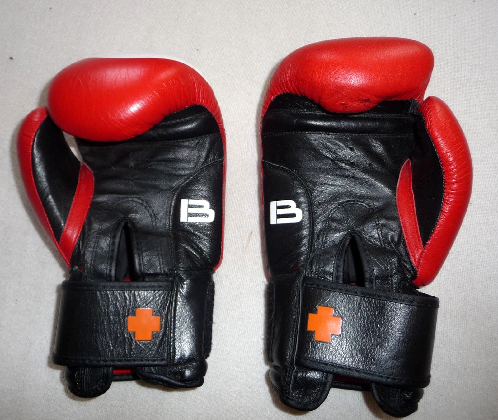 A pair of leather boxing gloves.